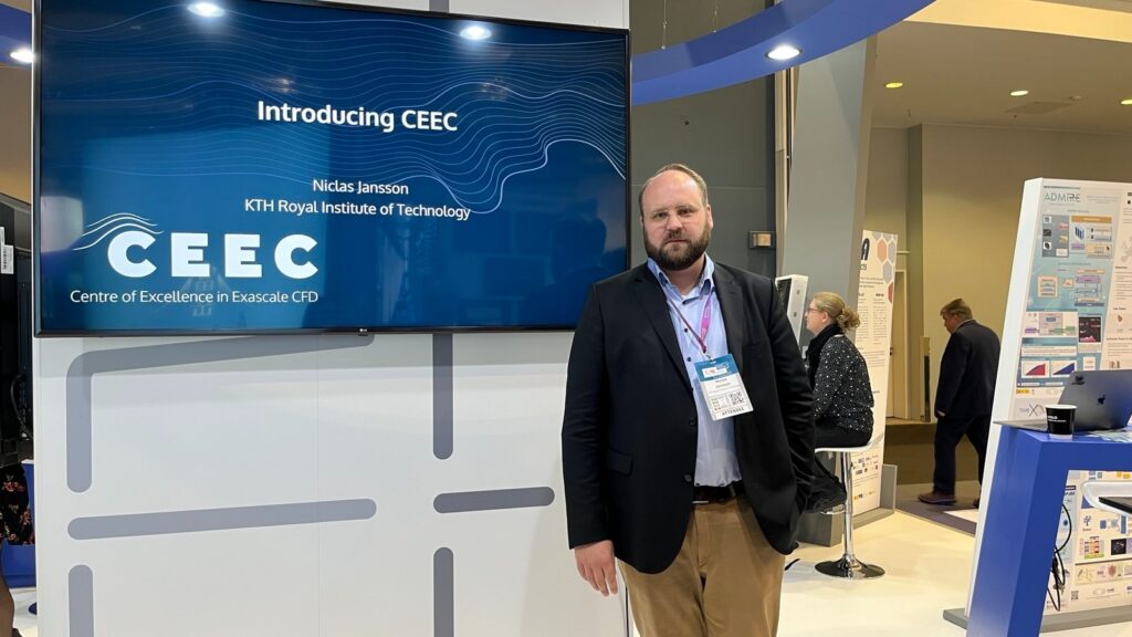 Niclas Jansson stands to the right of a large screen showing an intro slide that says 'Introducing CEEC' and lists his name all in the CEEC brand and colors of white and grey on a dark blue/green background.